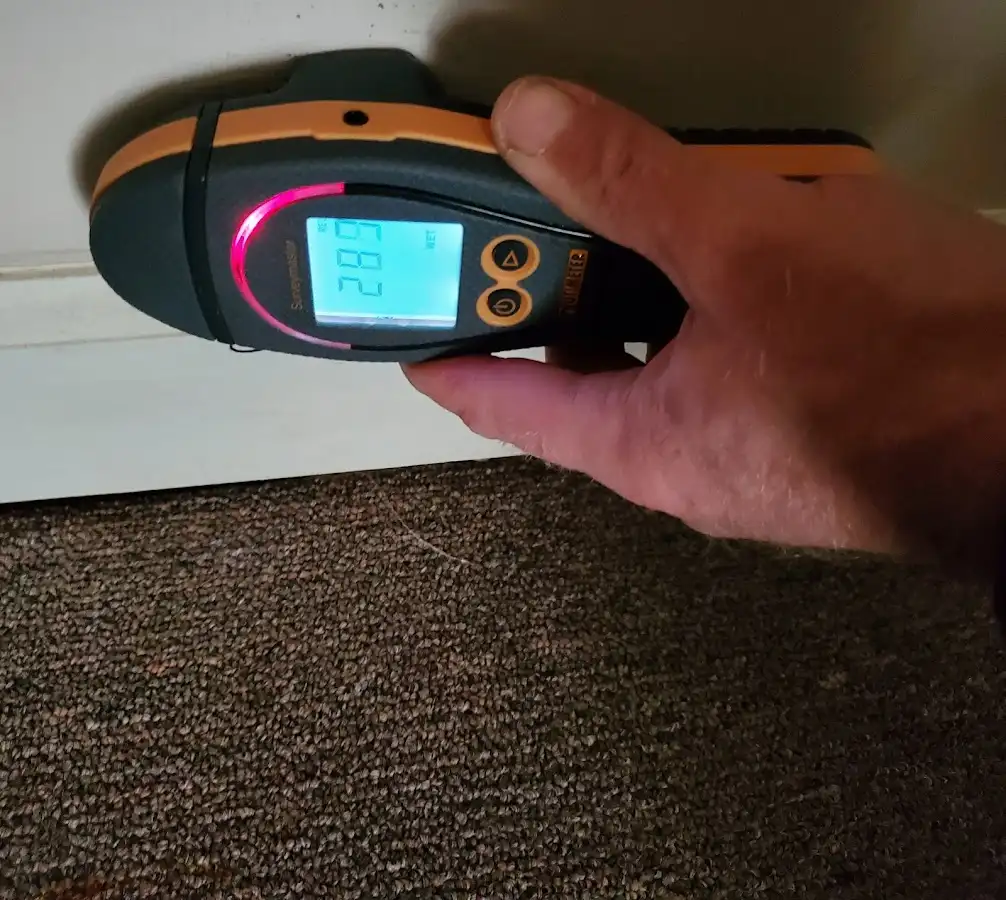 Moisture detection at baseboard during Storm Damage Restoration in Lansdowne